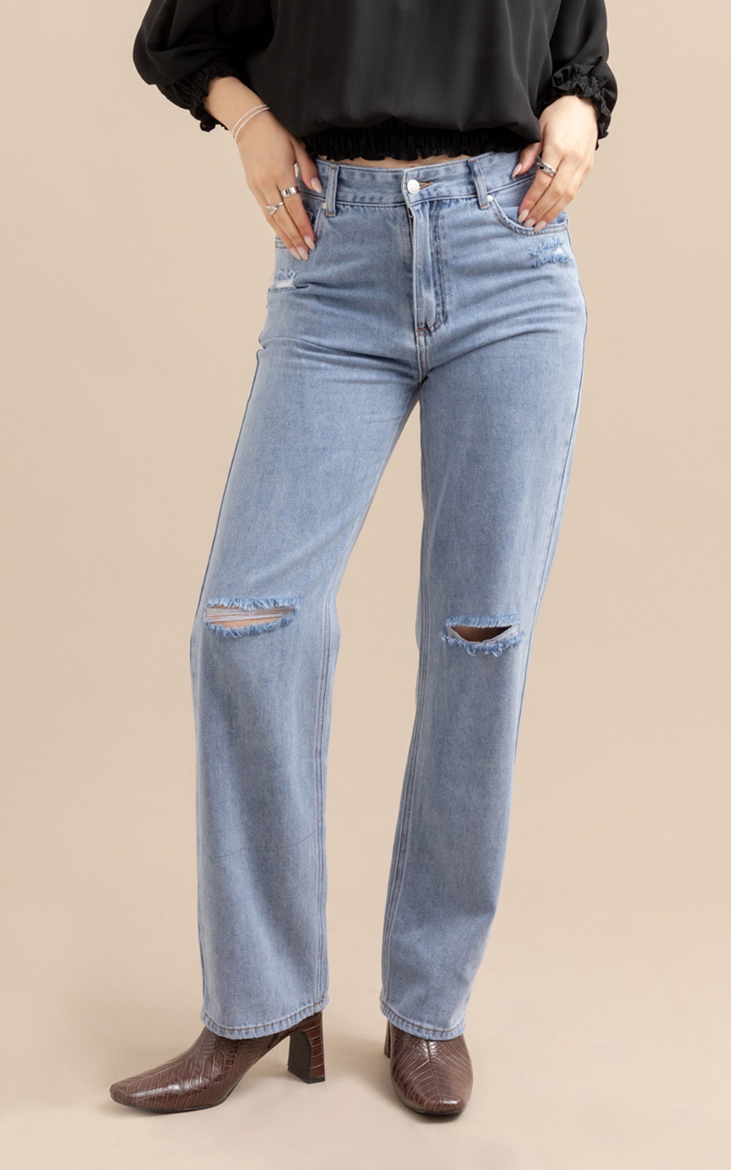 Jeans with ripped shops knees