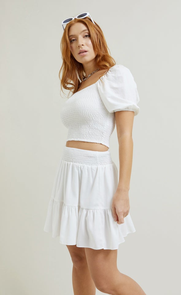 https://www.pagani.co.nz/content/products/tiered-mini-skirt-white-main-69128.jpg?width=590&height=960&fit=crop